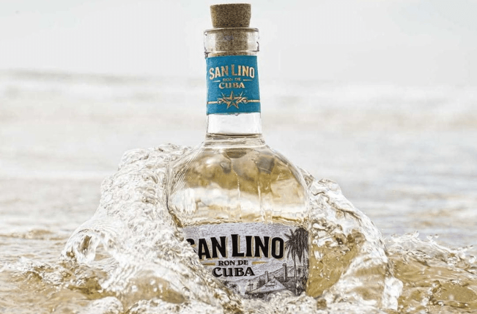SAN LINO CARTA BLANCA BOTTLE EMERGING FROM THE OCEAN